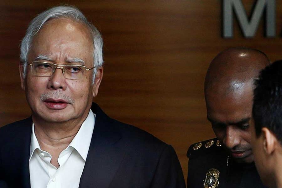 Malaysia's former prime minister Najib Razak arrives to give a statement to the Malaysian Anti-Corruption Commission (MACC) in Putrajaya, Malaysia May 24, 2018. Reuters