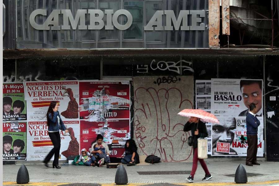 A woman looks at shoes at a shoe store in Buenos Aires, Argentina May 17, 2018. Reuters/Files