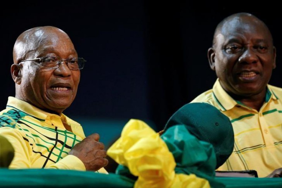 Former leader of South Africa Jacob Zuma (L) sits next to President Cyril Ramaphosa at the 54th National Conference of the ruling African National Congress (ANC) at the Nasrec Expo Centre in Johannesburg, South Africa on December 16, 2017 - Reuters/File