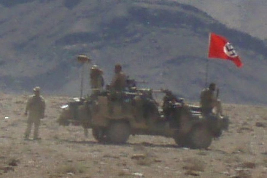 A nazi flag fllying over an Australian army vehicle. Photo: ABC