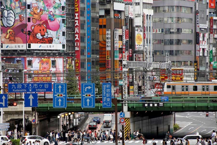 People cross the street at a shopping district in Tokyo, Japan, September 8, 2016. Reuters/File Photo