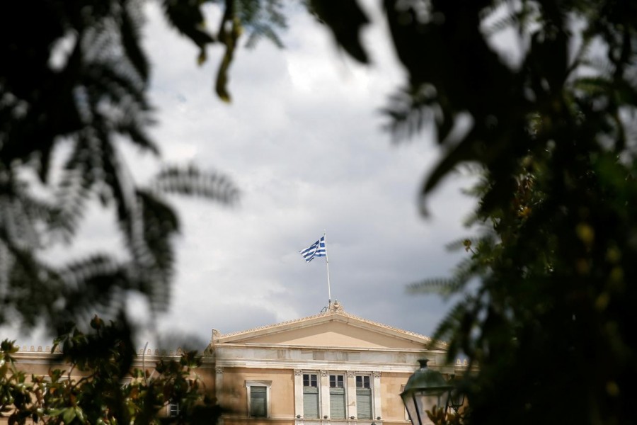 A Greek flag flutters atop the parliament building in Athens, Greece, June 21, 2018. Reuters