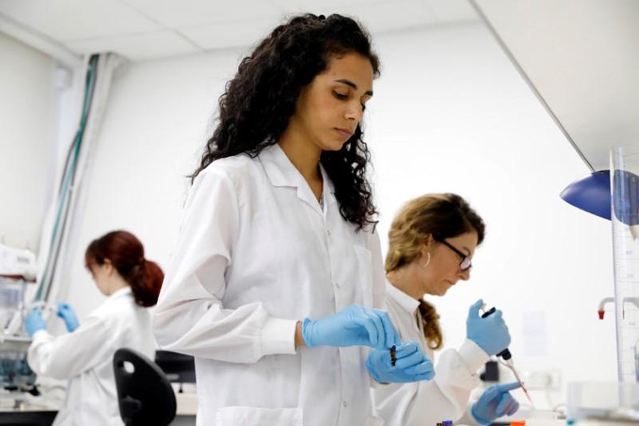 Workers are seen at the laboratory of Israeli company UroGen Pharma in Raanana, Israel, June 17. Reuters/File Photo