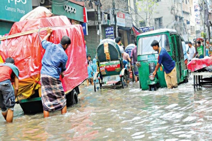 Commuters suffer as torrential rain inundates city roads