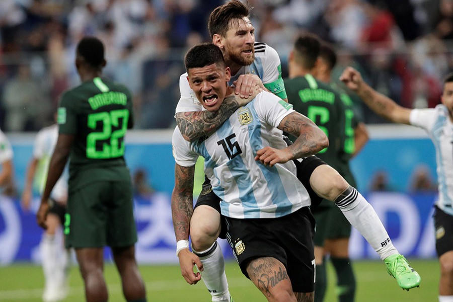 Argentina's Marcos Rojo celebrates scoring their second goal with Lionel Messi - Reuters photo