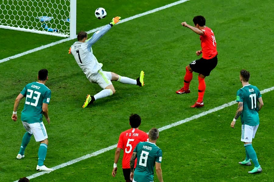 South Korea's Kim Young-gwon scoring their first goal against Germany, knocking Germany out of the World Cup on Wednesday. -Reuters Photo