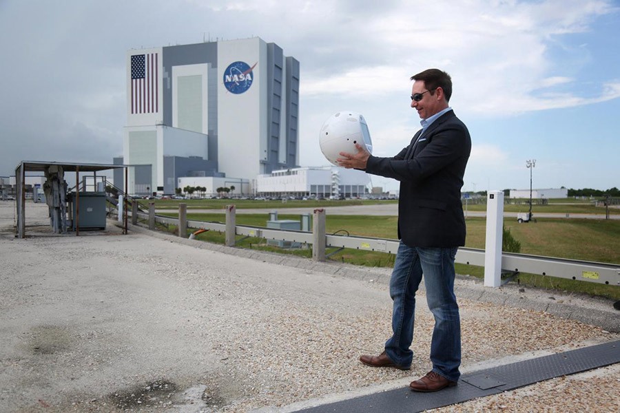 Bret Greenstein of IBM holds an artificial intelligence bot named CIMON, following a news conference at the Kennedy Space Center in Florida, US on Thursday - Reuters photo