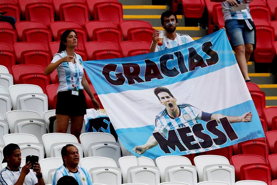 Fans displaying a banner of Argentina's Lionel Messi before the blockbuster World Cup round of 16 match at Kazan of Russia on Saturday. -Reuters Photo