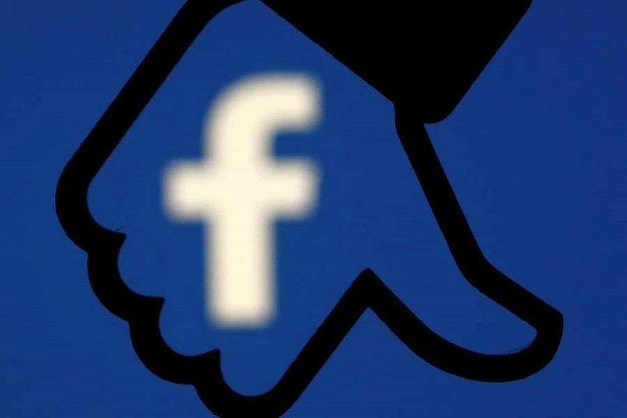 A 3D-printed Facebook like button is seen in front of the Facebook logo in this illustration taken October 25, 2017. Reuters/Illustration/File Photo