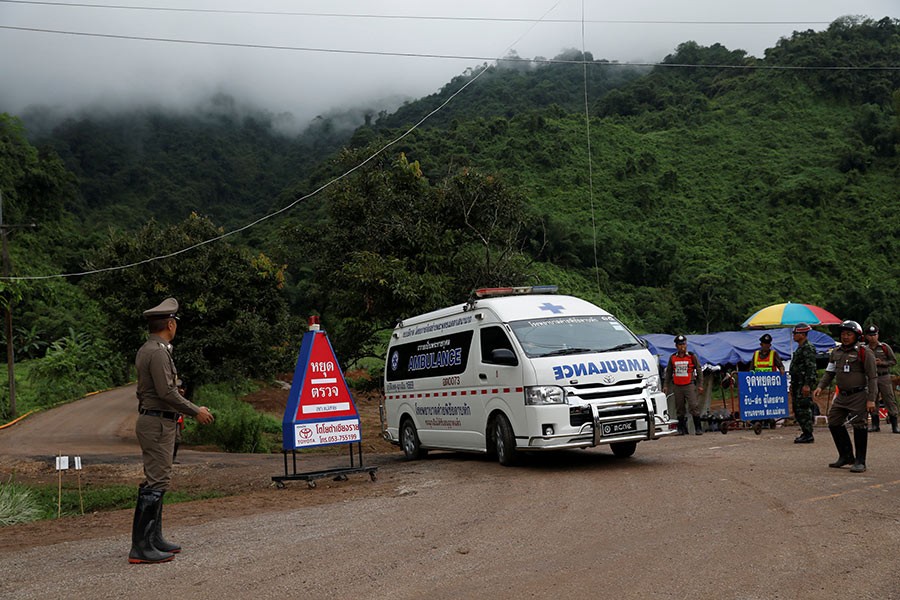 An ambulance is seen Tham Luang cave complex, where scoolboys are trapped in a flooded cave, in the northern province of Chiang Rai, Thailand on Monday - Reuters