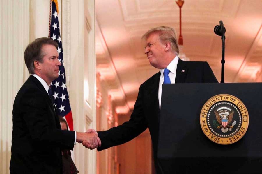 US President Donald Trump introduces his Supreme Court nominee judge Brett Kavanaugh (L) in the East Room of the White House in Washington, US, July 9, 2018. Reuters