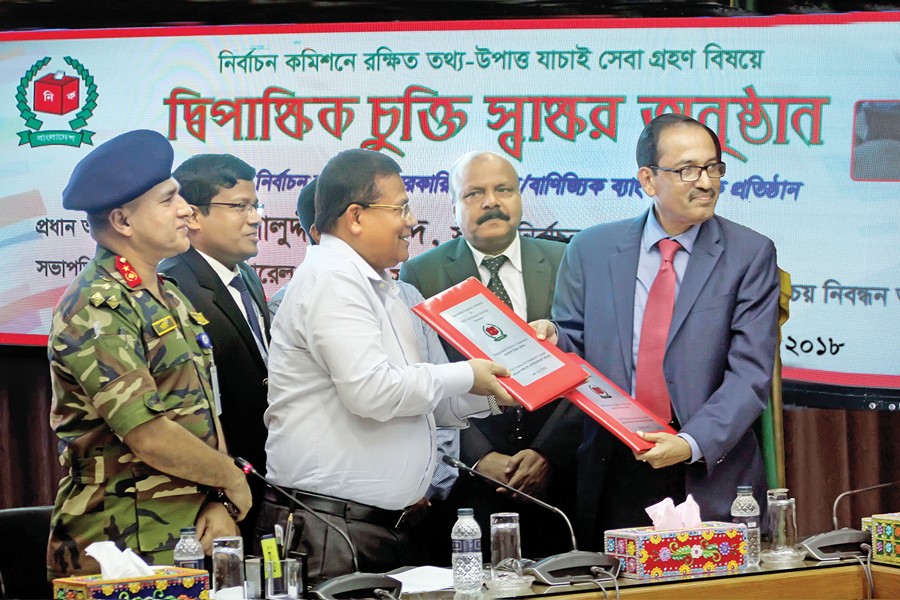 Joint Secretary & Director (Operations), NID Registration Cell Md. Abdul Baten and Managing Director & CEO of FAS Finance & Investment Ltd. Pritish Kumar Sarker exchanging documents after signing an agreement on behalf of their respective organisations recently to verify NID