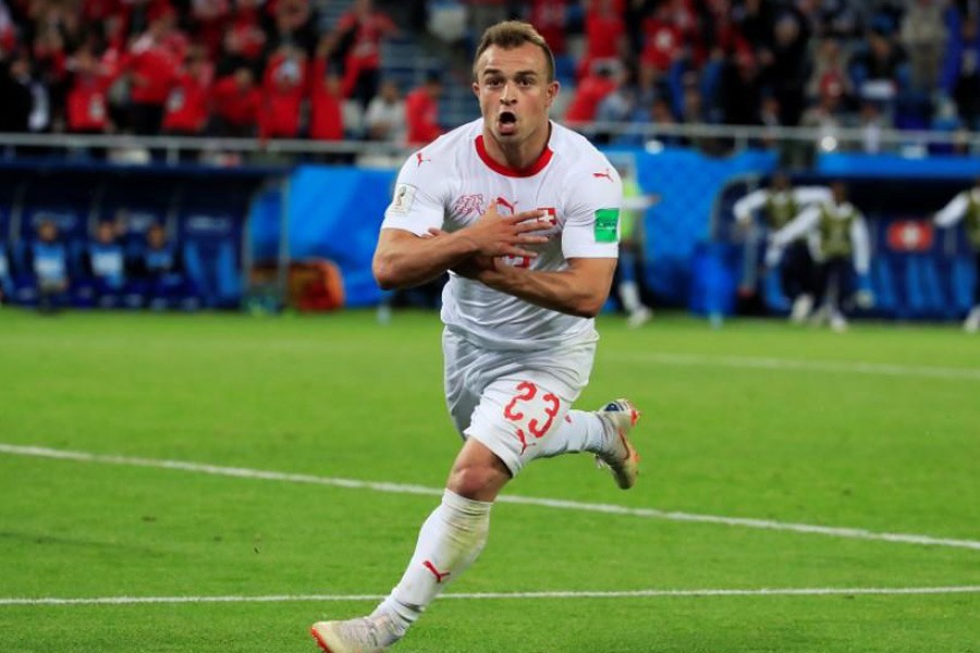 Switzerland's Xherdan Shaqiri celebrates scoring their second goal against Serbia in the World Cup – Reuters