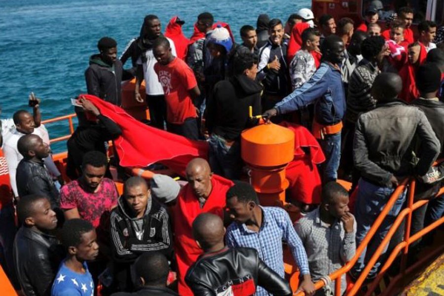 Migrants, intercepted aboard two dinghies off the coast in the Strait of Gibraltar, wait on a rescue boat to disembark after arriving at the port of Tarifa, southern Spain July 15, 2018 – Reuters