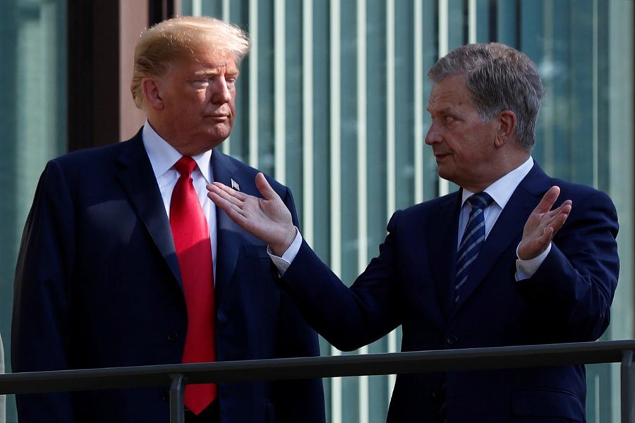 US President Donald Trump and Finland's President Sauli Niinisto posing for a photo in Helsinki of Finland on Monday. -Reuters Photo