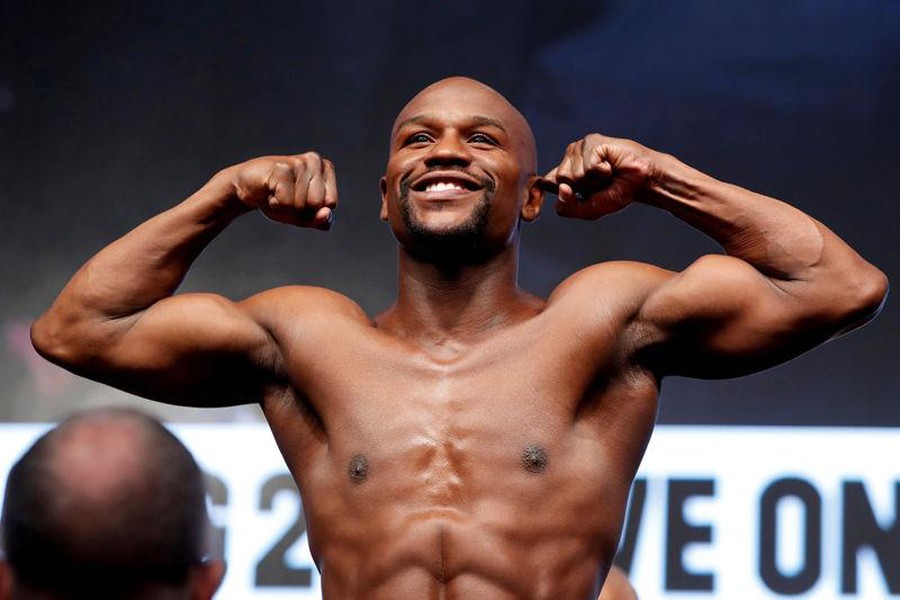 Boxer Floyd Mayweather Jr of the US poses in the scale during his official weigh-in at T-Mobile Arena in Las Vegas, Nevada, US on August 25, 2017. Reuters/File photo