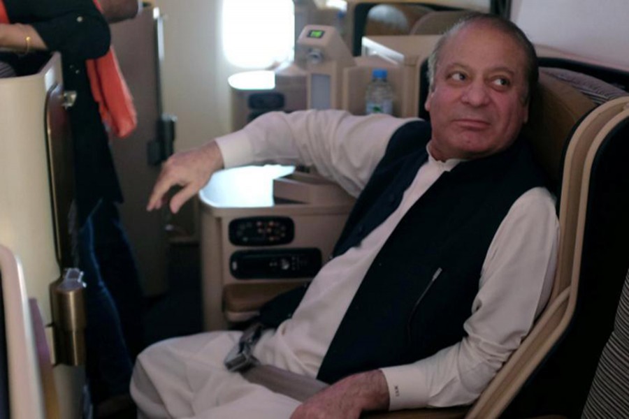 Ousted Pakistani Prime Minister Nawaz Sharif sits on a plane after landing at the Allama Iqbal International Airport in Lahore, Pakistan on July 13 last — Reuters photo