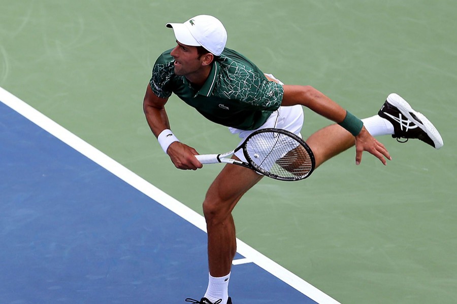 Djokovic seen in this action image — Collected