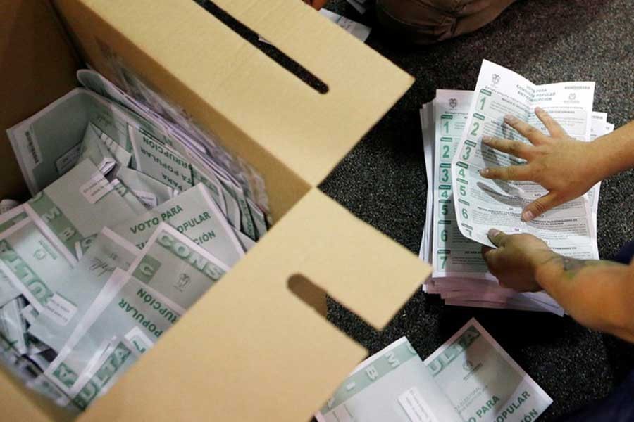 Electoral officials count ballots after tables closed during the seven-question referendum on anti-corruption measures in Bogota, Colombia August 26, 2018. Reuters