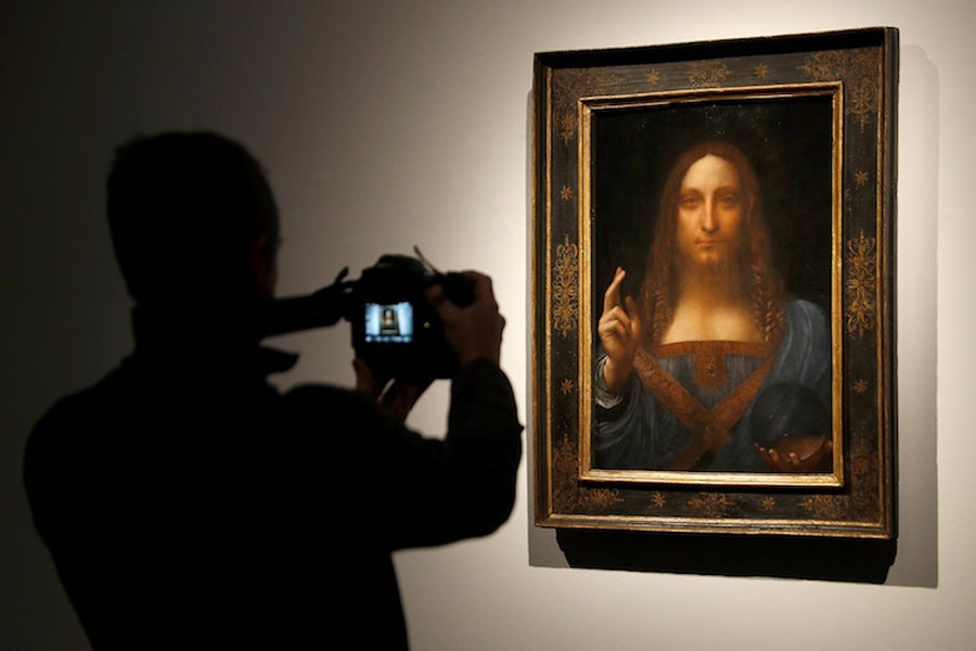 A member of Christie’s staff takes a picture of Leonardo da Vinci’s ‘Salvator Mundi’ painting in London October 24, 2017. Reuters file photo