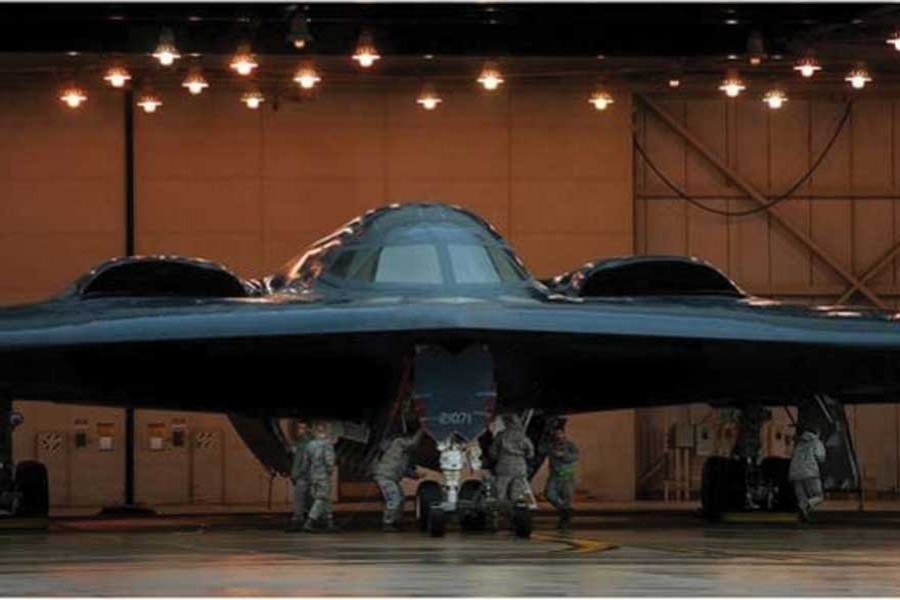 US Air Force maintenance technicians assigned to the 509th Aircraft Maintenance Squadron work on a B-2 stealth bomber at Whiteman Air Force Base, Mo. on March 19, 2011. The unit maintains aircraft tasked with strategic nuclear deterrence and global strike operations. 	—Credit: Kenny Holston/US Air Force