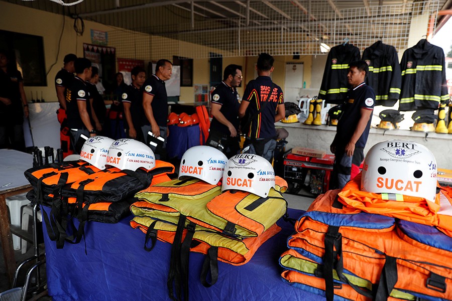 Rescuers ready their gear before Super Typhoon Mangkhut hits the main island of Luzon, in Muntinlupa, Metro Manila, in Philippines on Thursday — Reuters photo