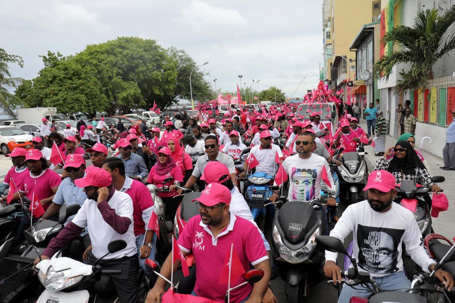 Supporters of the Maldivian President Abdulla Yameen ride on their bikes during the final campaign march rally ahead of the presidential election in Male, Maldives September 22, 2018 - Reuters