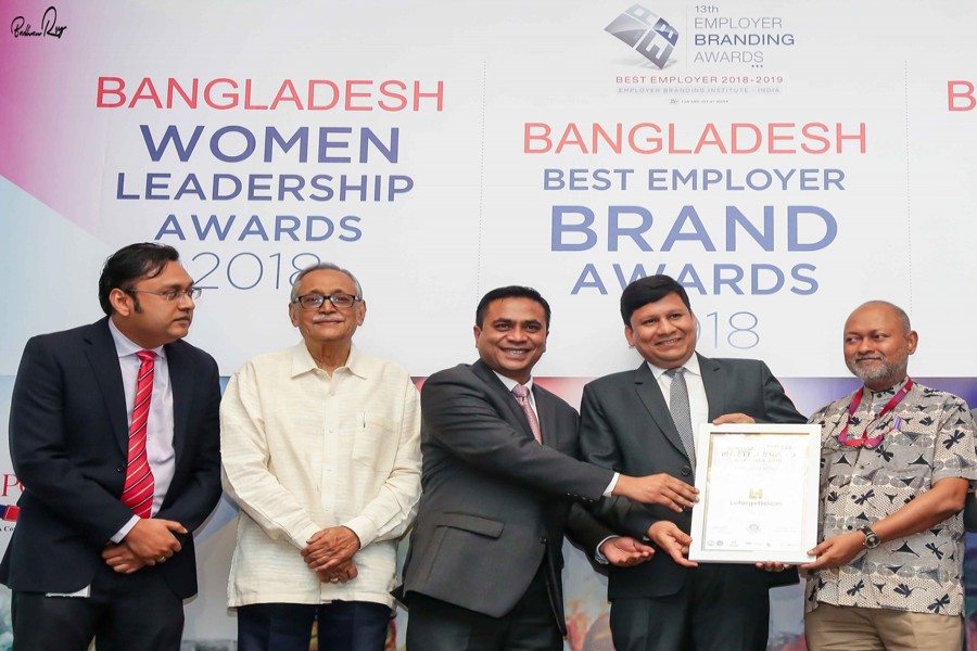 Rajesh K Surana, Chief Executive Officer, M. Asif Bhuiyan, Marketing & Transformation Commercial Director and Syed Naimul Abedin, Head of Marketing Strategy, Branding & Communication of LafargeHolcim Bangladesh Limited (LHBL) receiving the "Brand Leadership Award" accorded by CMO Asia on behalf of the company at the award giving ceremony at a city hotel recently