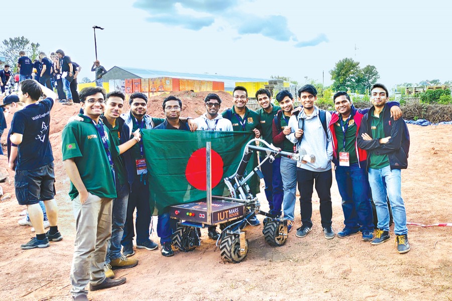 The IUT Avijatrik team that participated in European Rover Challenge 2018, a robotics competition, standing proudly with their rover