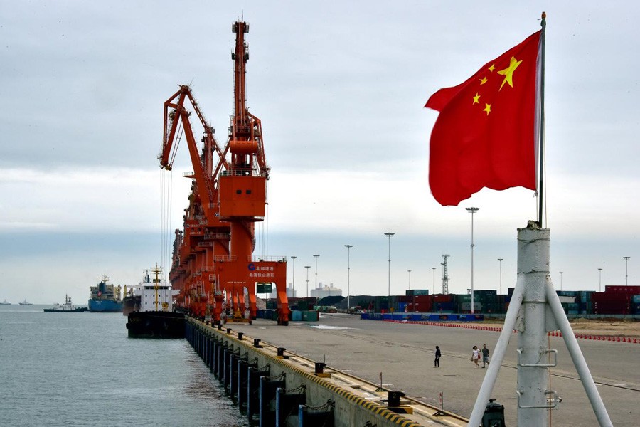 A Chinese national flag is seen at a port in Beihai, Guangxi province, China, June 17, 2017. Reuters