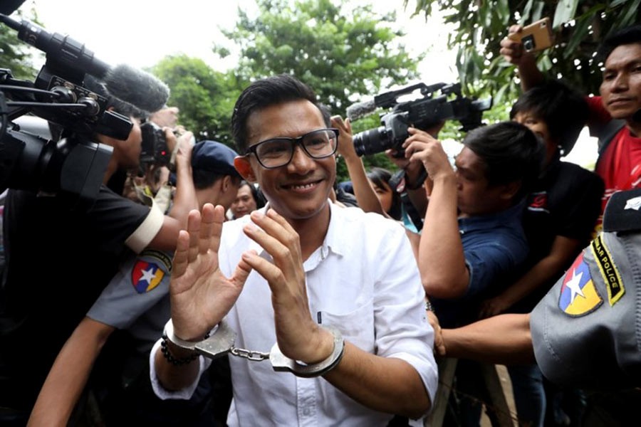 Kyaw Zaw Linn, the editor in charge at Eleven Media arrives after being detained at Tamwe court in Yangon of Myanmar on Wednesday. -Reuters Photo