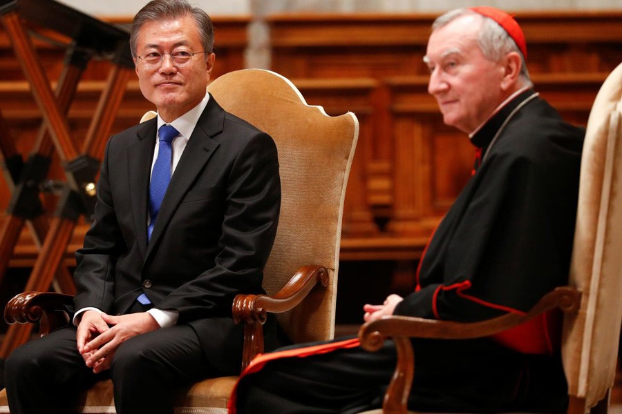 South Korean President Moon Jae-in sits with Italian cardinal Pietro Parolin at the end of a special mass for peace in the Korean peninsula in Saint Peter's Basilica at the Vatican, October 17, 2018. Reuters