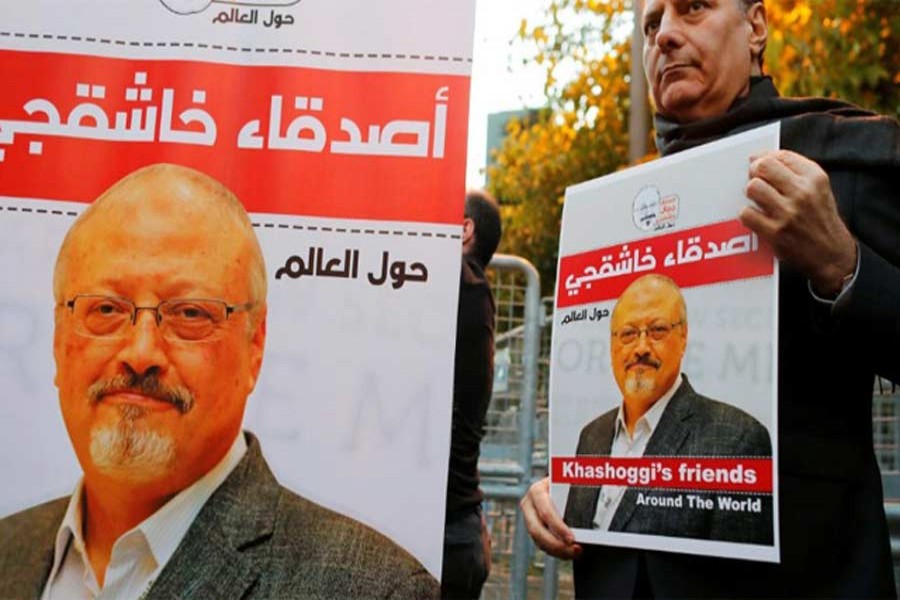 Friends of Saudi journalist Jamal Khashoggi hold posters and banners with his pictures during a demonstration outside the Saudi Arabia consulate in Istanbul, Turkey, October 25, 2018. Reuters/File Photo