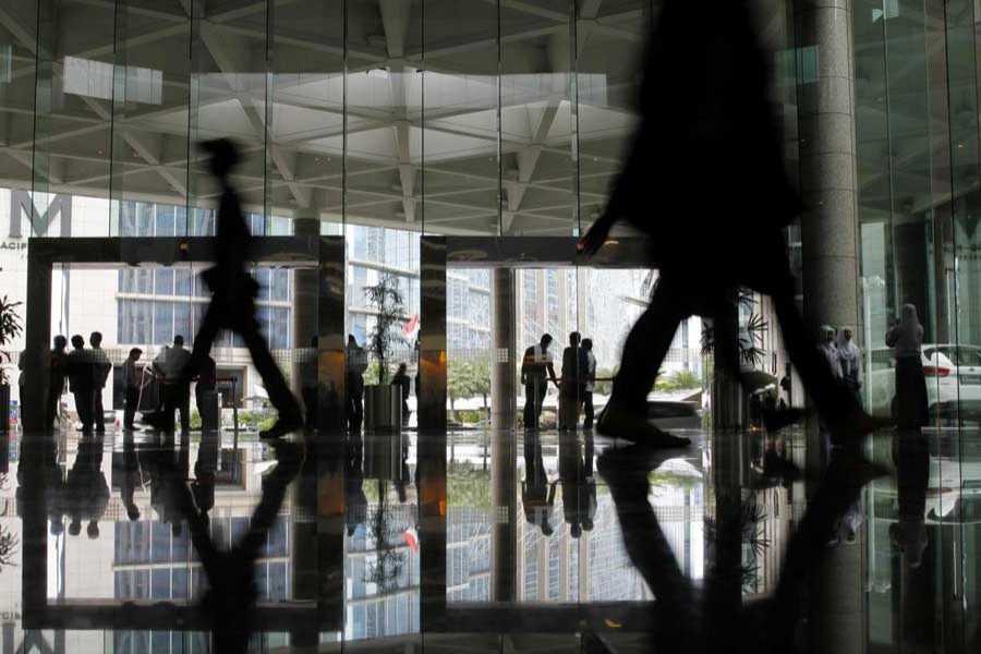 People stand in the lobby of the Indonesia Stock Exchange building in Jakarta, June 12, 2013. Reuters/Files