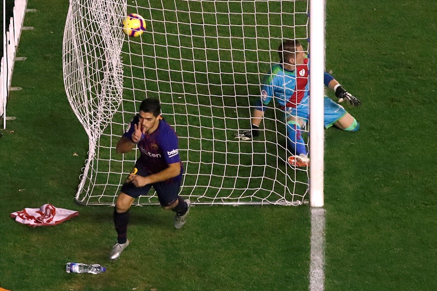 Barcelona's Luis Suarez celebrates scoring their third goal which seals the late victory for his team — Reuters photo