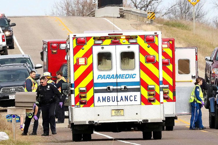 Emergency medical personnel gather at the scene of a hit-and-run accident Saturday, Nov 3, 2018, in Lake Hallie, Wisconsin, that killed two girls and an adult - Photo: Steve Kinderman/The Eau Claire Leader-Telegram via AP