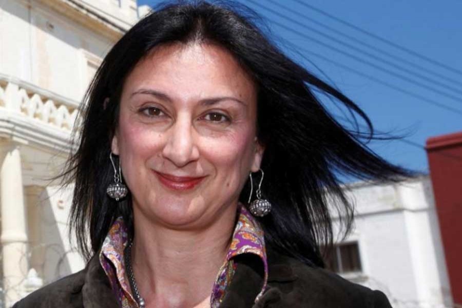 Maltese investigative journalist Daphne Caruana Galizia poses outside the Libyan Embassy in Balzan, Malta April 6, 2011. Picture taken April 6, 2011. - Reuters