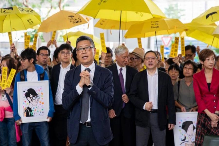 HONG KONG: Hundreds of supporters joining the nine accused activists outside the court on Monday 	— EPA