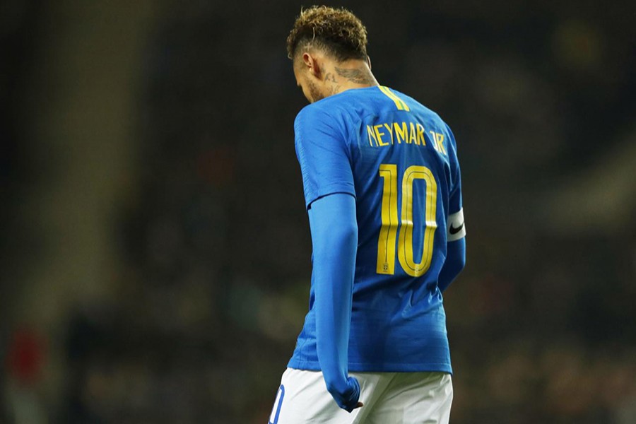 Brazil's Neymar looks dejected as he walks off injured during the match against Cameroon — Reuters photo