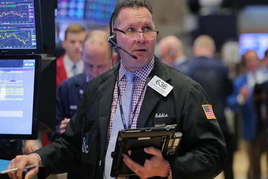 A trader works on the floor at the New York Stock Exchange (NYSE) in New York, US, November 21, 2018. Reuters