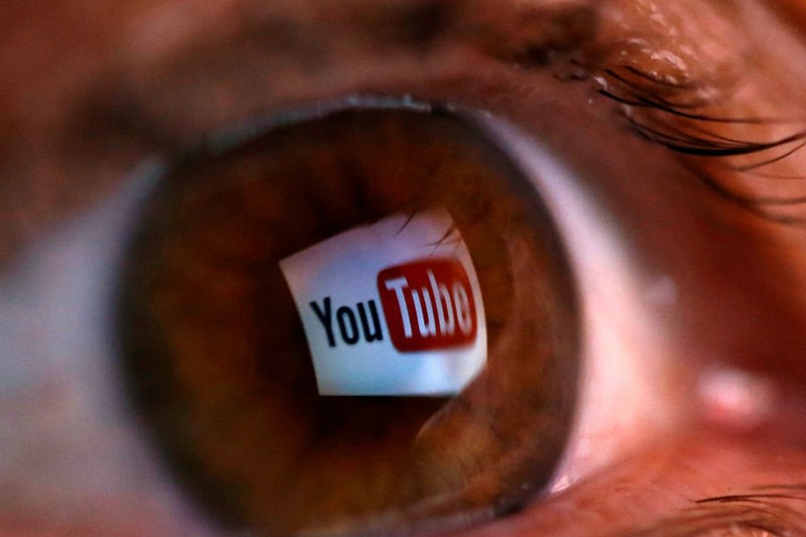 A picture illustration shows a YouTube logo reflected in a person's eye. Reuters/File