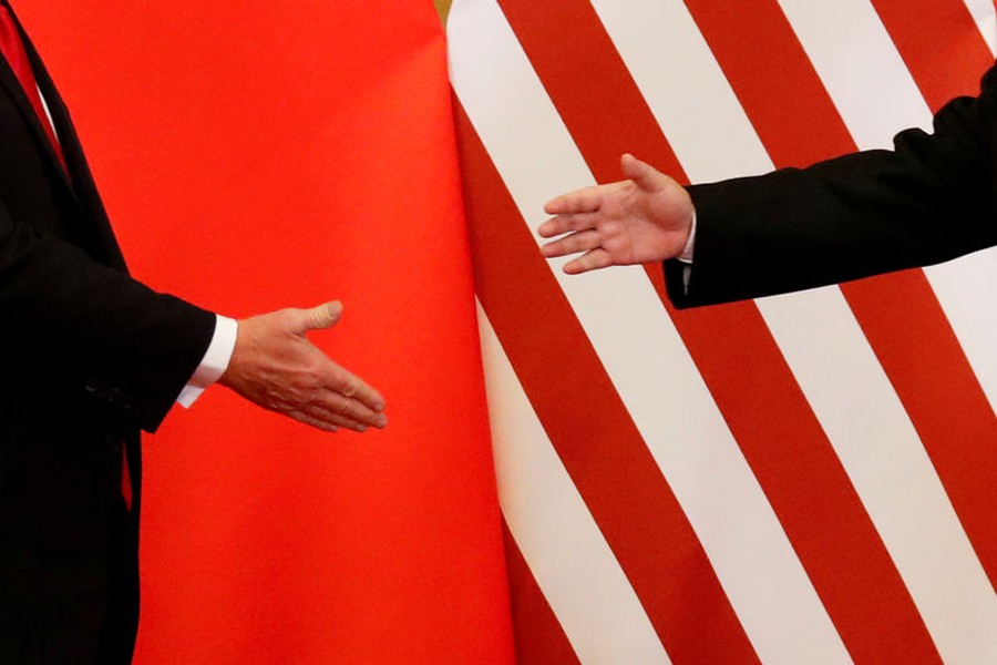 US President Donald Trump and China's President Xi Jinping shake hands after making joint statements at the Great Hall of the People in Beijing, China, November 9, 2017. Reuters/File Photo