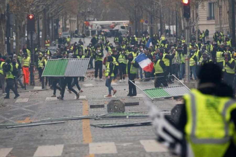 Protesters wearing yellow vests, a symbol of a French drivers' protest against higher diesel taxes, demonstrate in Paris, France - Reuters photo