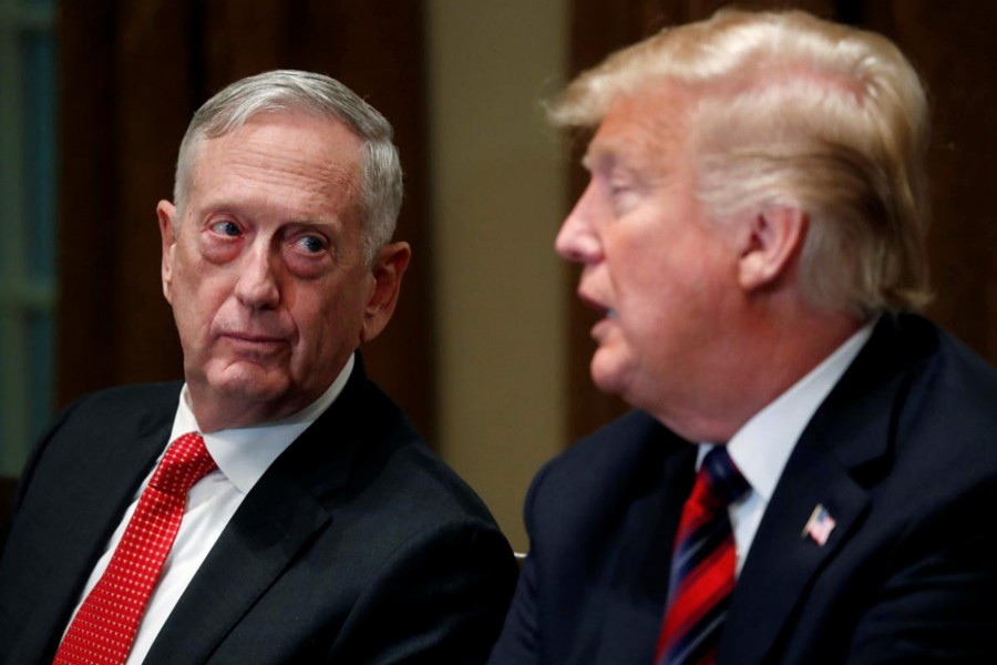 US Defense Secretary James Mattis listens as US President Donald Trump speaks to the news media while gathering for a briefing from his senior military leaders in the Cabinet Room at the White House in Washington, US, October 23, 2018. Reuters/Files