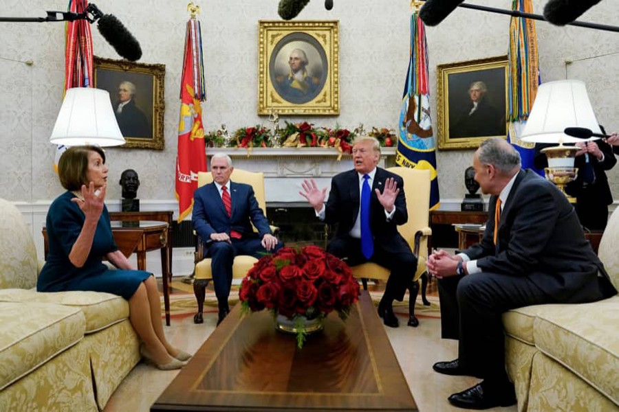 US House Speaker designate Nancy Pelosi (D-CA) speaks with Vice President Mike Pence and US President Donald Trump as they meet with her and Senate Minority Leader Chuck Schumer (D-NY) in the Oval Office at the White House in Washington, US, December 11, 2018. Reuters/File Photo