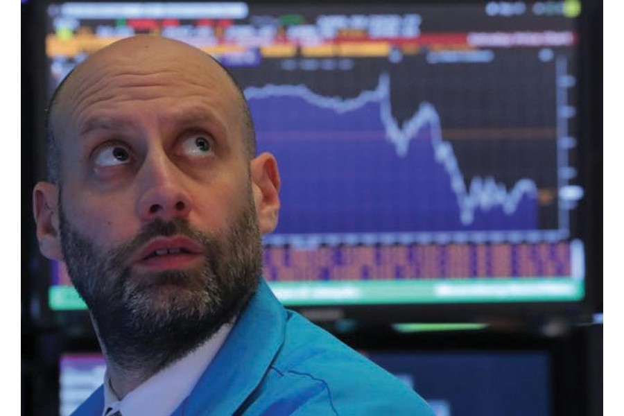 A trader works at his post on the floor of the New York Stock Exchange (NYSE) in New York on December 19, 2018. A severe economic downturn could be disastrous for President Donald Trump, says Lincoln Mitchell.          —Photo: Reuters