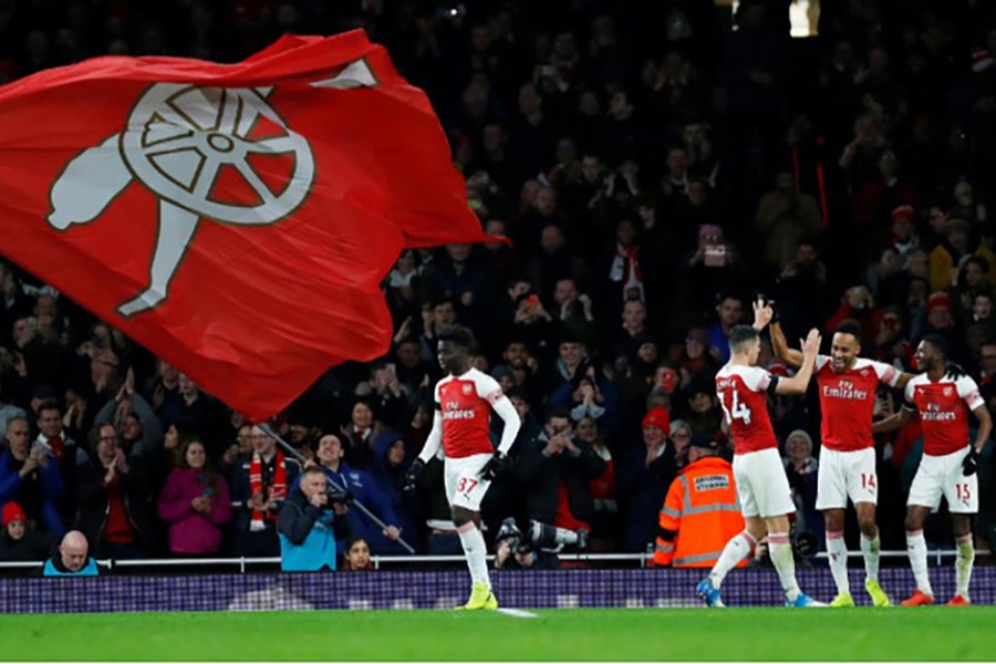 Arsenal's Pierre Emerick Aubameyang celebrates scoring their fourth goal with teammates — Reuters photo