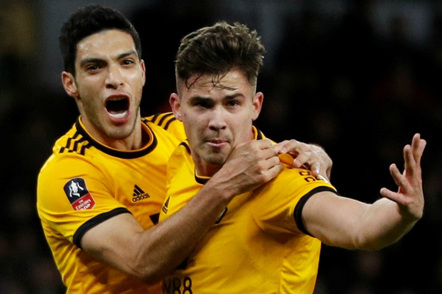 Wolverhampton Wanderers' Raul Jimenez (L) celebrates scoring their first goal with Leander Dendoncker — Reuters action image