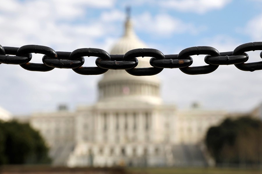 The US Capitol is seen beyond a chain fence during the partial government shutdown in Washington. The photo was taken on January 8. -Reuters Photo