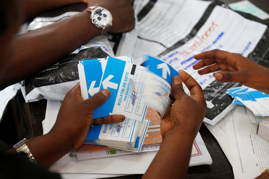 A man examines voting materials at Congo's Independent National Electoral Commission (CENI) tallying centre in Kinshasa, Democratic Republic of Congo, January 1, 2019 - Reuters/Files